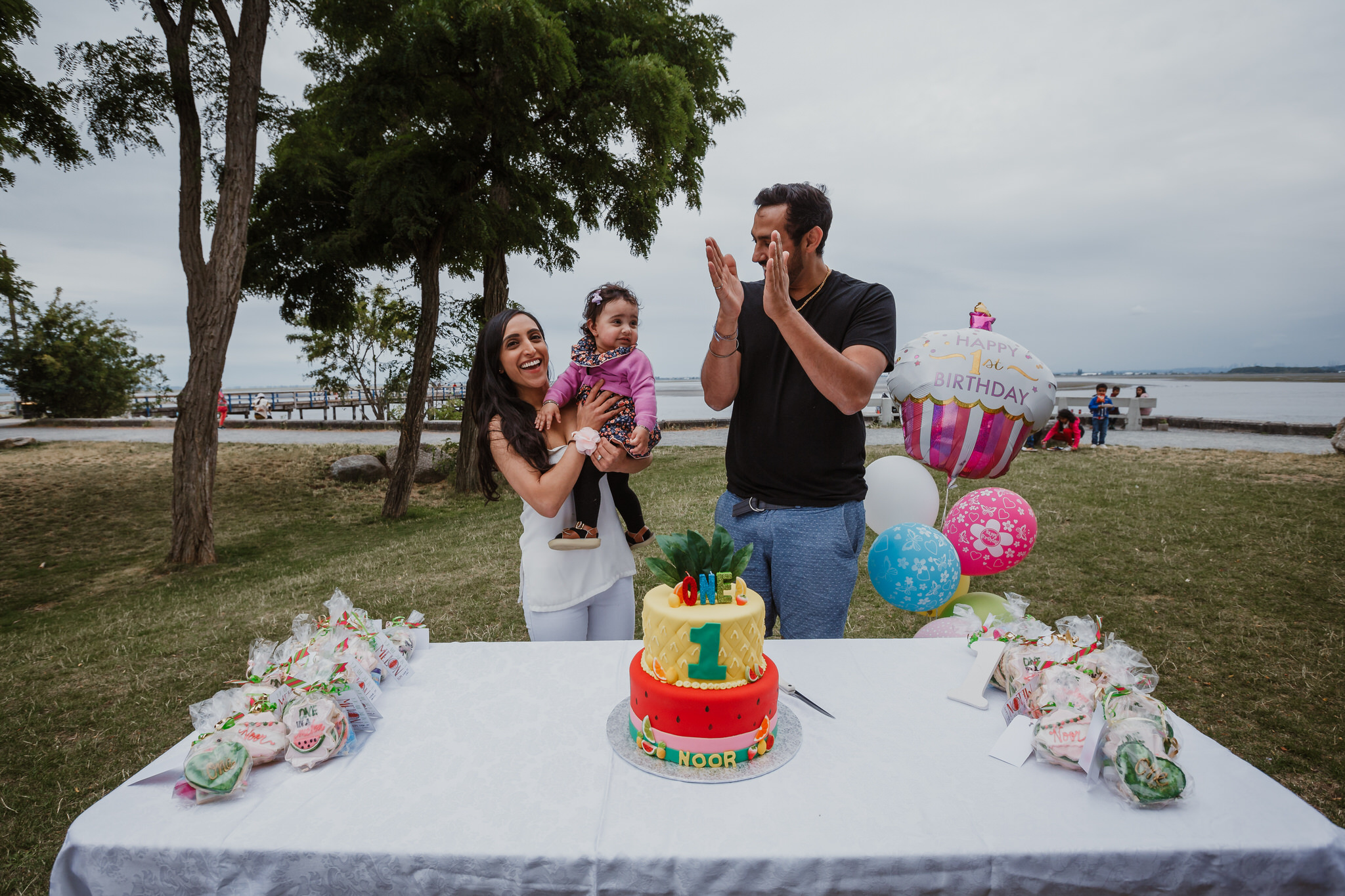 Parents celebrating daughter's first birthday in Crescent Beach White Rock Surrey BC Canada