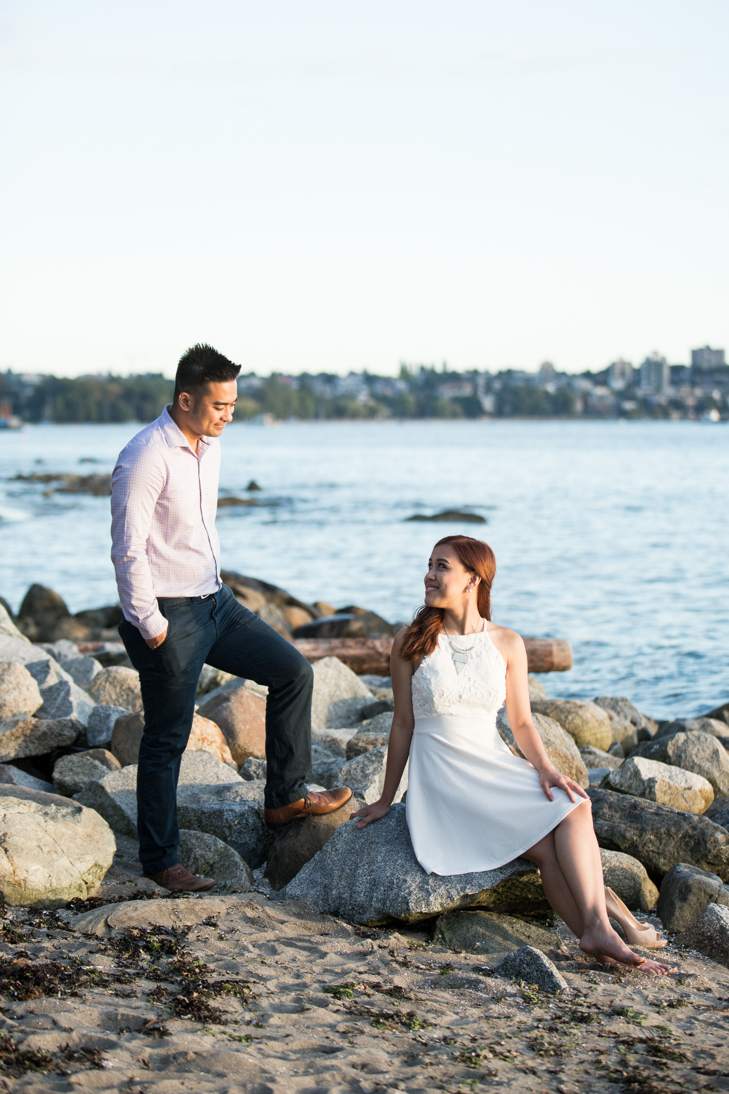 Couple looking at each other at Second beach in Stanley park by Vancouver wedding photographer THIS IS IT STUDIOS