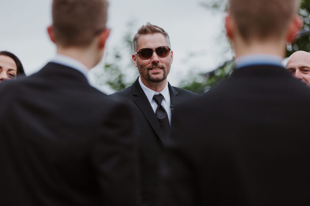 Candid photo of the groom mingling with guests at spanish banks