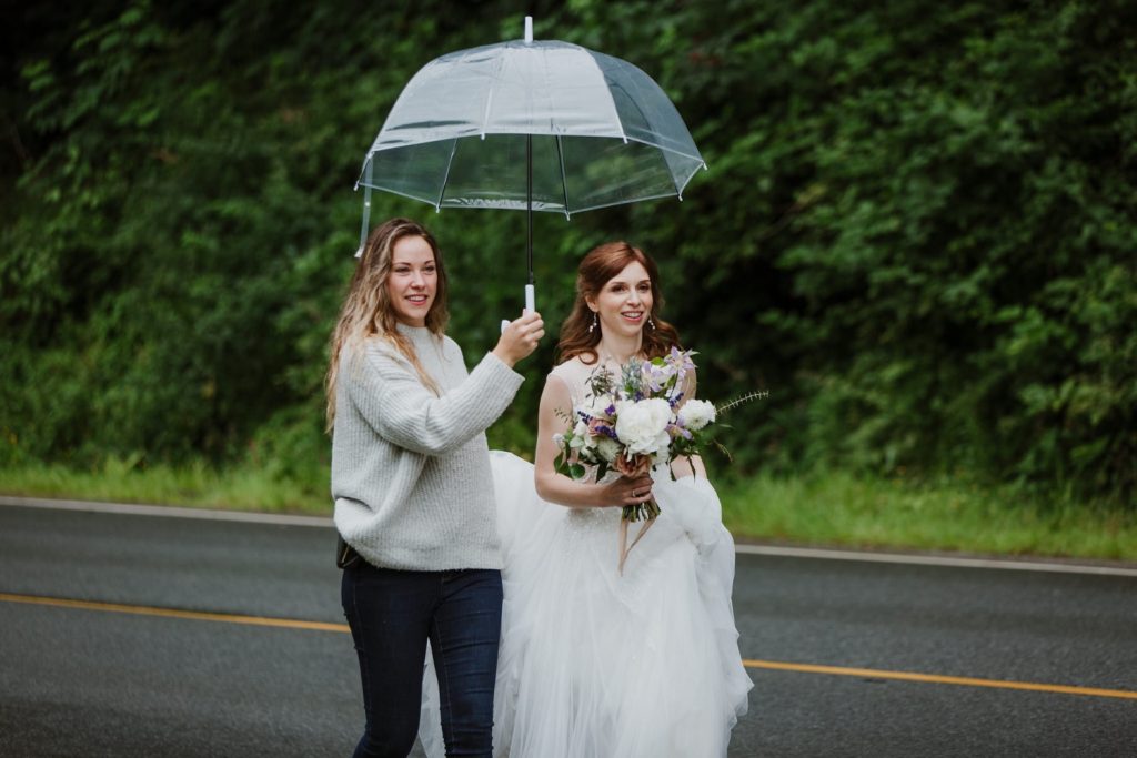 Wedding planner assisting the bride to the ceremony at spanish banks