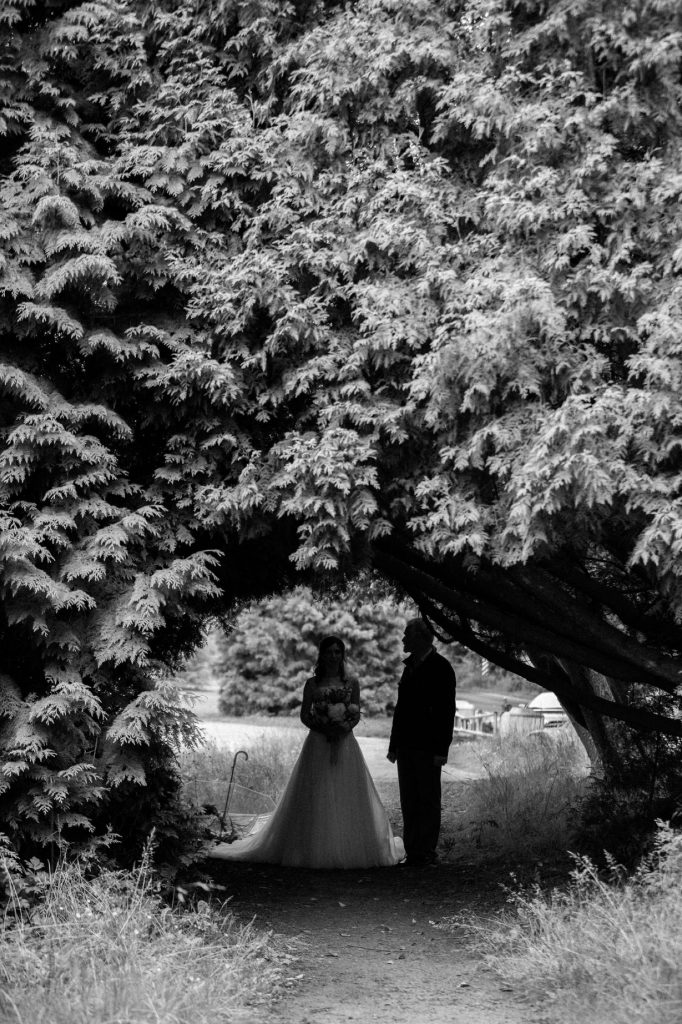 Bride waiting to go down the aisle in Spanish Banks