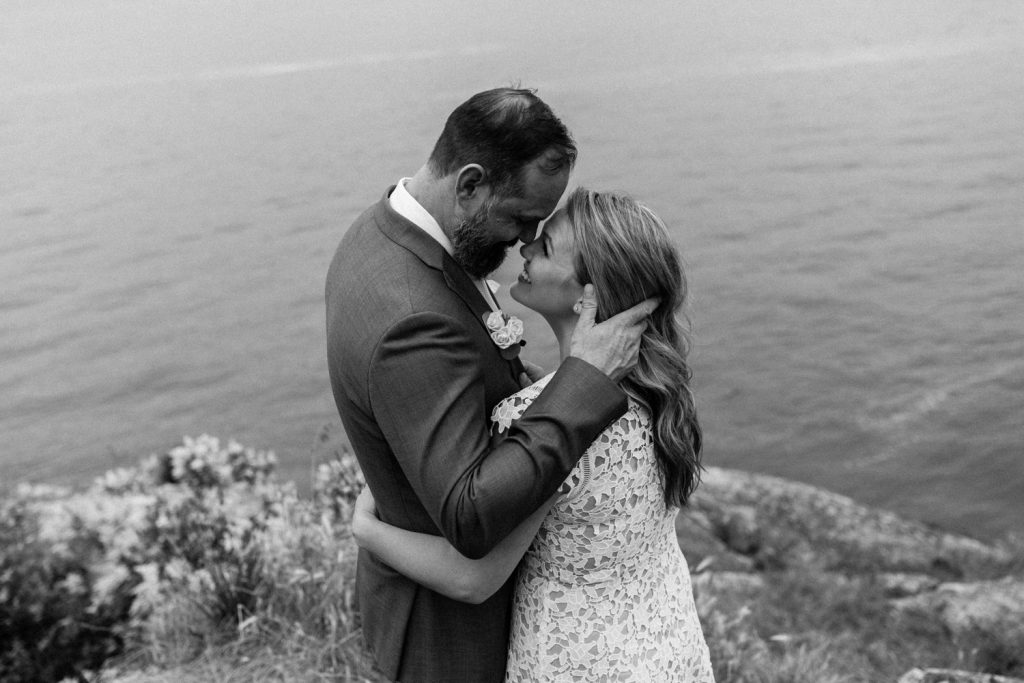 Candid photo of bride and groom looking at each other in whytecliff park