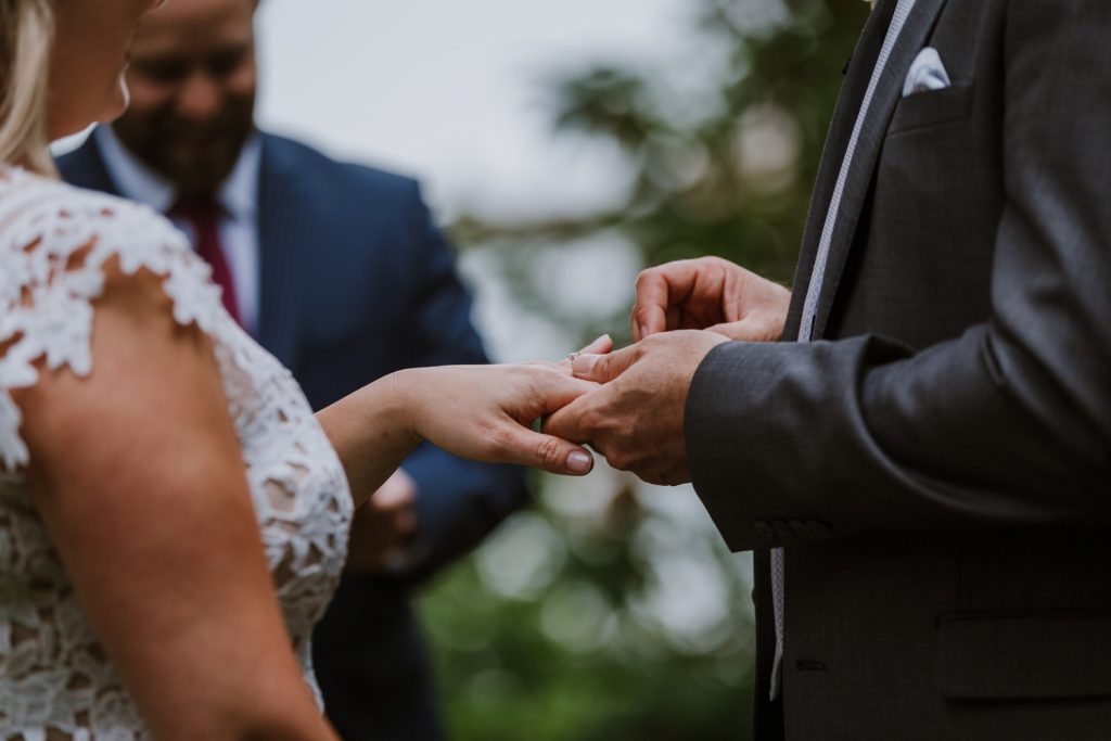 Bride and groom exchanging rings during the elopement ceremony