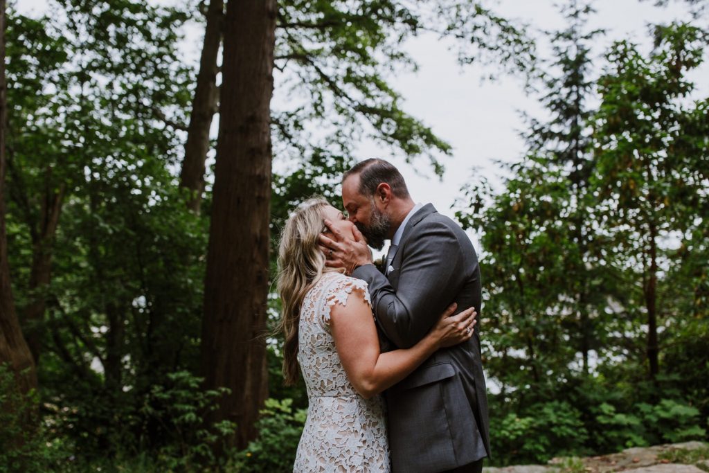 Bride and groom's first kiss during the elopement ceremony